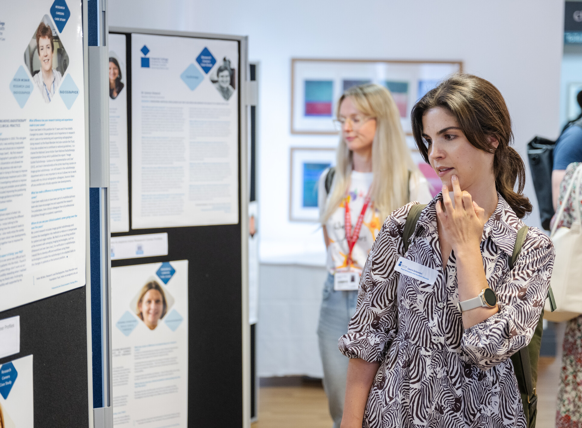 Delegates viewing researchers posters at CATO celebration event