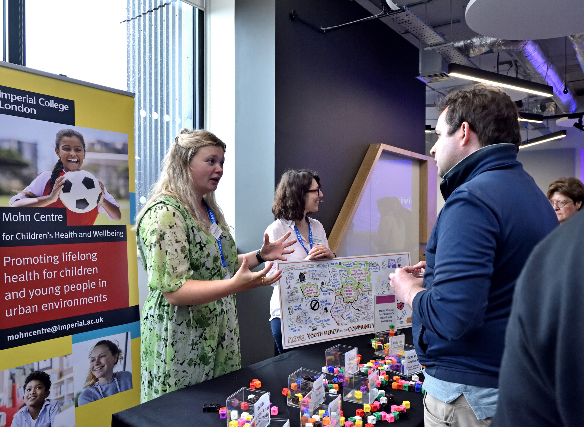 Guests learning about research work in Imperial.