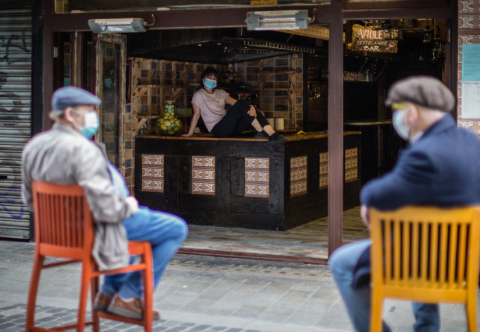 People socialising in a London cafe