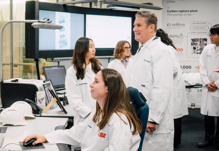 People in labcoats in a discussion