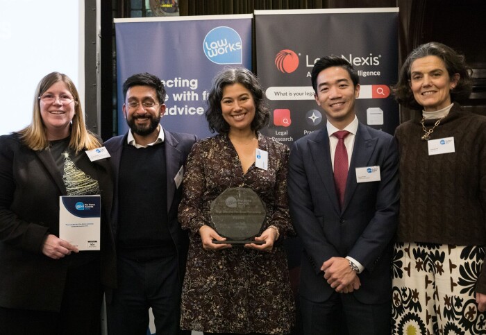 The GTLC steering committee with the award for Most Effective Pro Bono Partnership