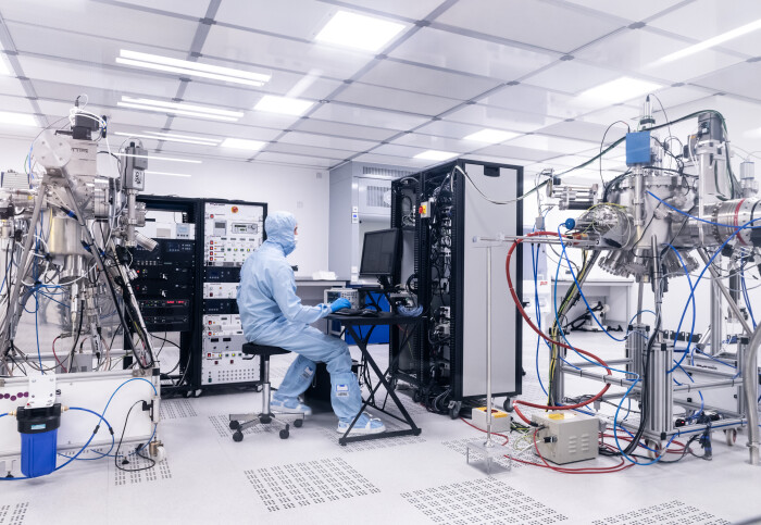 A researcher working in the Clean Room at Royce Imperial.