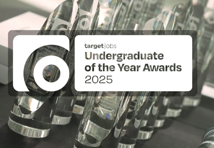 image showing a person clapping in an auditorium with vibrant lighting, and a logo in the top left corner that reads "targetjobs Undergraduate of the Year Awards 2025.