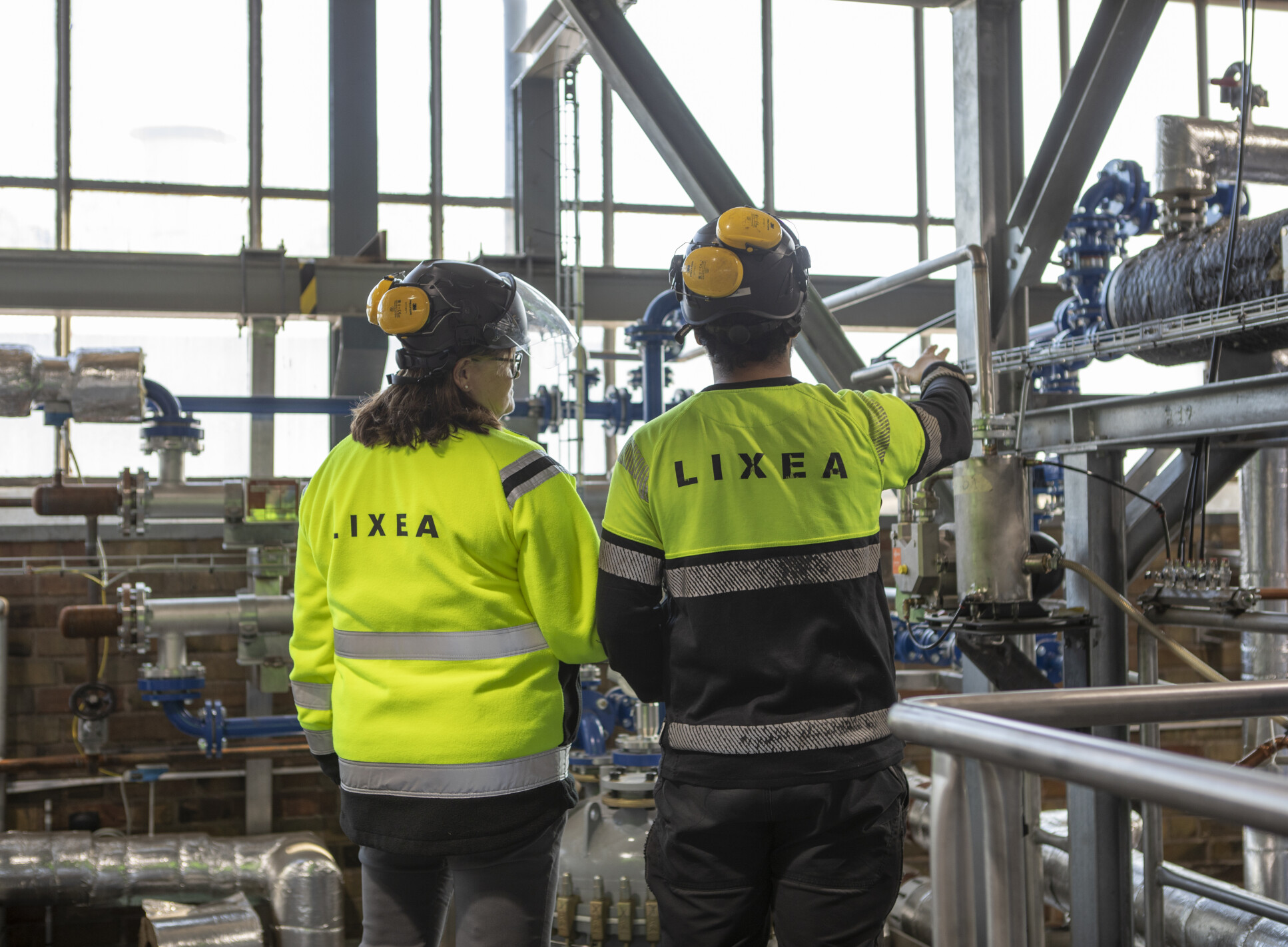 Two Lixea engineers standing in the company's pilot-scale plant