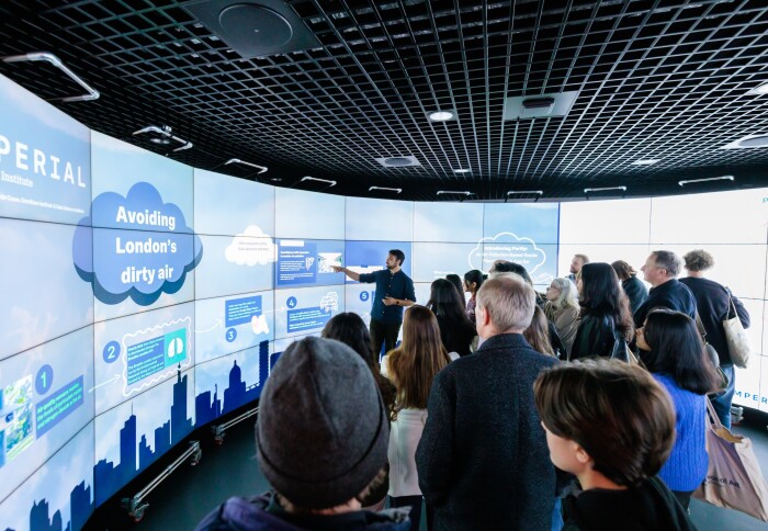 Imperial researcher presenting in the data observatory at Imperial lates