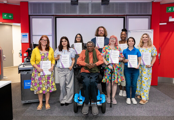 A group of colleagues holding their Calibre leadership certificates