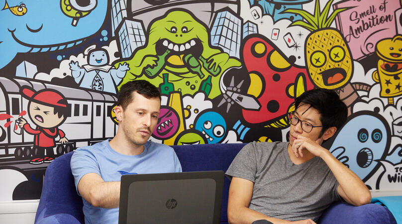 Two students chatting in the Imperial Enterprise Lab